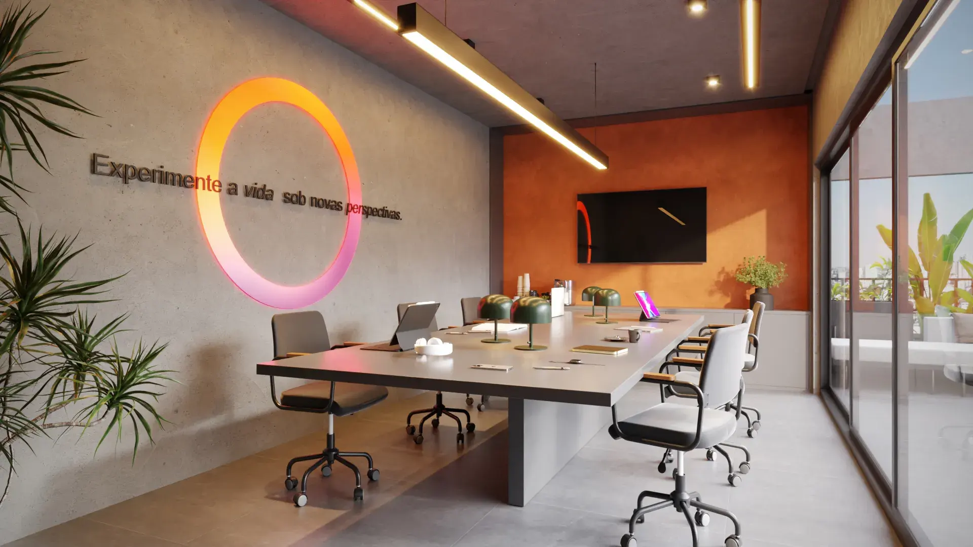 Sala de coworking do Liv Sintonia, com mesa compartilhada e vista para a varanda